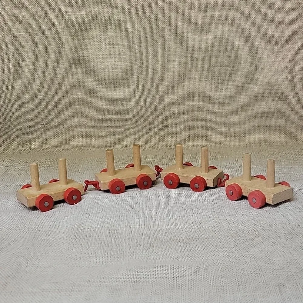 Assorted small wood‎ vehicles..train, dumo truck, race cars...